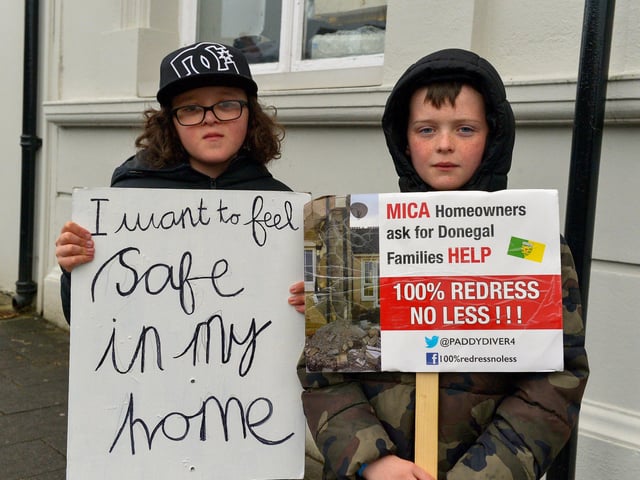 Zak and Ethan McDonnell, from Ramelton, at the MICA protest outside the Playhouse, in Artillery Street, on Friday evening last, during a visit by Taoiseach Micheál Martin to a John Hume Foundation event in the venue. Photo: George Sweeney. DER2213GS – 057
