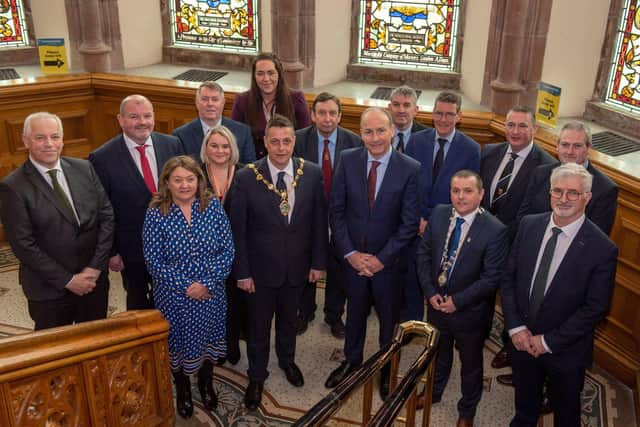 No Fee for reproduction  An Taoiseach Micheal Martin is welcomed to the Guildhall by Alderman Graham Warke, Mayor of Derry City and Strabane District Council and Councillor Martin McDermott Leas, Cathaoirleach, Donegal County Council with members of the North West Regional Development Group. Picture Martin McKeown. 01.04.22