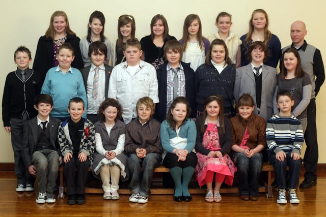 Pupils from Trench Road Primary School who were confirmed in the Church of the Immaculate Conception, Waterside, by Most Rev. Dr. Francis Lagan, Auxiliary Bishop of Derry. Included is Mr. Conrad McGuigan, class teacher. (0302C22)