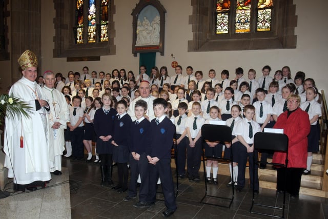 Cardinal Keith O'Brien, Most Rev. Dr. Framcis Lagan, Auxiliary Bishop of Derry, and Mst Rev. Dr. Seamus Hegarty, Bishop of Derry, with the Trench Road Primary School choir who performed at the Mass in St. Eugene's Cathedral on Tuesday morning. (2702C13)
