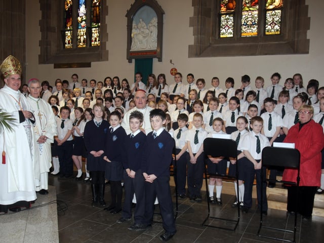 Cardinal Keith O'Brien, Most Rev. Dr. Framcis Lagan, Auxiliary Bishop of Derry, and Mst Rev. Dr. Seamus Hegarty, Bishop of Derry, with the Trench Road Primary School choir who performed at the Mass in St. Eugene's Cathedral on Tuesday morning. (2702C13)
