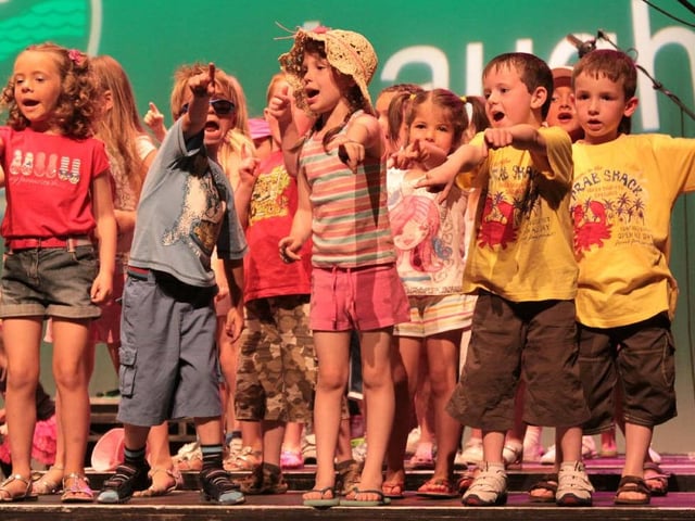 Year 1 and 2 pupils at Trench Road Primary School who sang about their summer holidays at the school's end of year show in the Millennium Forum. (Trench Road Year1&2M1)