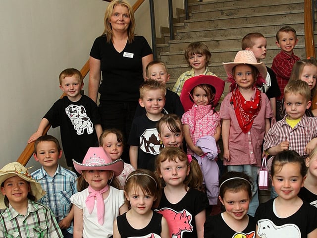 P1 pupils who put on show their version of ‘Old McDonald had a farm’, at the Trench Road Primary School’s annual summer variety show, held at The Millennium Forum.  Included is their teacher Mrs. Sarah Cairns.  (1806T09).
