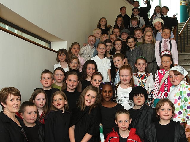 Class P5 teacher Mrs. Marion O’Neill, with her pupils who put on show their play ‘Farewell to Ireland’, at the Trench Road Primary School’s annual summer variety show, held at The Millennium Forum. (1806T11).
