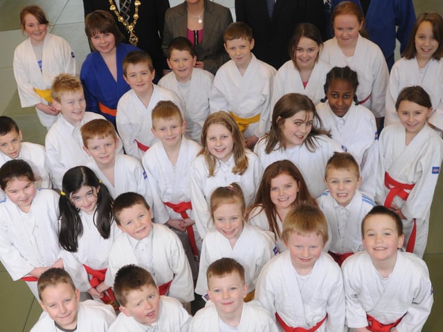 Minister for Social Development, Margaret Ritchie pictured with pupils from Trench Road PS, at the announcement that the Department for Social Development, is to acquire and oversee redevelopment and regeneration of the former Clondermot School. Included, are The Mayor of Derry, Councillor Gerard Diver, Dr James Mehaffey, Mark Durkan, MP, MLA, and Jim Toland, Derry City Council, Judo Grass Roots.