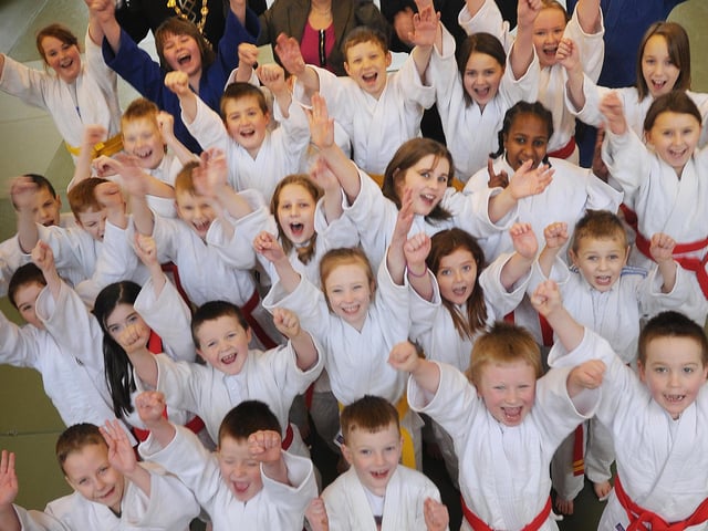 Minister for Social Development, Margaret Ritchie pictured with pupils from Trench Road PS, at the announcement that the Department for Social Development, is to acquire and oversee redevelopment and regeneration of the former Clondermot School. Included, are The Mayor of Derry, Councillor Gerard Diver, Dr James Mehaffey, Mark Durkan, MP, MLA, and Jim Toland, Derry City Council, Judo Grass Roots.