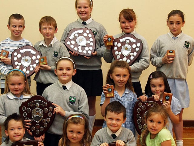 Children at the Trench Road PS, who collected ‘Commitment’ awards at the school’s end of term prize-giving. (2706T04).