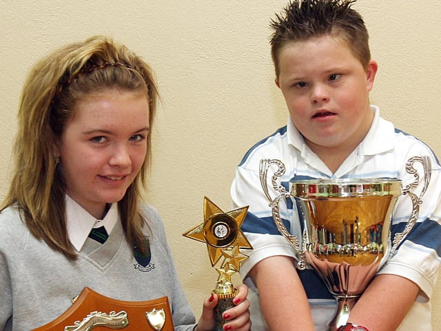 Pupil Kellie McCauley, who received the Freddy Clifford Shield for Music and Robert Harkin, the Webb cup for ‘Overall Student’ at the Trench Road PS end of term prize-giving. (2706T05).