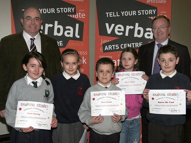 A group P5 pupils at Lisnagelvin PS and The Trench Road PS, who have made a digital storytelling DVD entitled "Sharing Stories", which was shown in a special viewing at the Waterside Theatre. The project was created through a series of workshops facilitated by the Verbal Arts centre and funded by the Schools Community Relations programme through the Western Education and Library Board. Included are Brendan Bradley (left), principal, trench Road PS and William MElwaine, principal, Lisnagelvin PS. LS15-527MT.