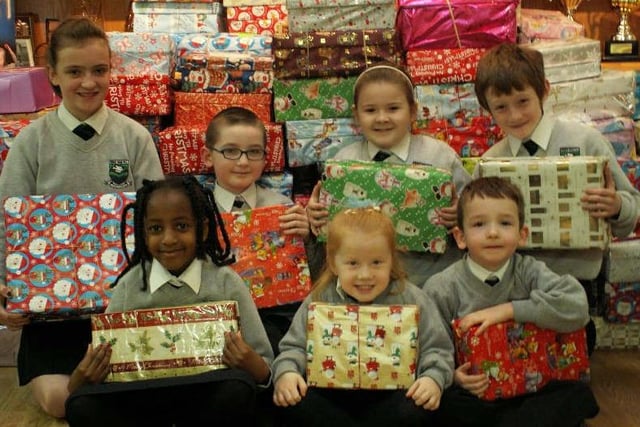 Children from Trench Road PS pictured with a selection of the 200 shoe boxes they've have collected as part of the Road of Hope campaign.  Included from left are: Laura McNamee, Manal Elshafie, Jordan Kent, Aoife McLaughlin, Aine Gillespie, Shane Doherty and Jack McLaughlin. (2511M1)