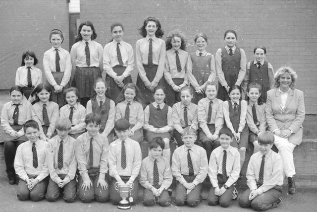 Pupils from St. Anne’s Primary School, Rosemount, who won the A.O.H. Challenge Cup for Primary School Orchestras at 1997 Feis. Included is their conductor Sue Mellon.