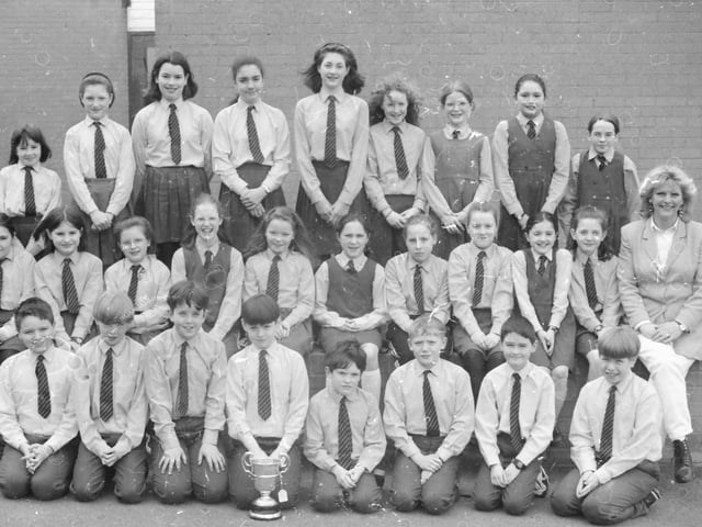 Pupils from St. Anne’s Primary School, Rosemount, who won the A.O.H. Challenge Cup for Primary School Orchestras at 1997 Feis. Included is their conductor Sue Mellon.