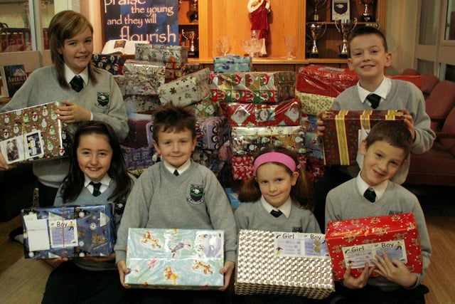 Pupils from Trench Road Primary School, Waterside displaying some of the 250 boxes collected as part of the  
school's Road of Hope Christmas Shoebox Appeal.  The  
boxes will be sent to Bosnia and Croatia to children suffering extreme  isolation, poverty and the traumas of war.  Pictured, front left are Aoife Fleming, Shea Boyle, Erin McCloskey and Conall  McCloskey.  Back from left are Kellie McCauley and Anthony McGuigan.