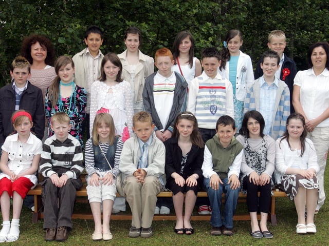 Pupils from Trench Road Primary School who were confirmed in the Church of the Immaculate Conception by Most Rev. Dr. Francis Lagan, Auxiliary Bishop of Derry. Included are Ms. Siobhan Mallon, teacher, and Mrs. Claire O'Kane, classroom assistant. (0106C54)