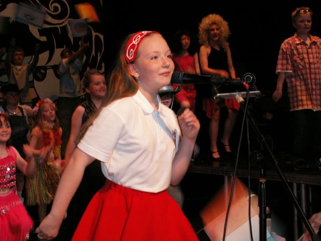 Aine Henderson and Year 6 pupils performing 'It's A Small World' at the Trench Road PS summer show in the Waterside Theatre.