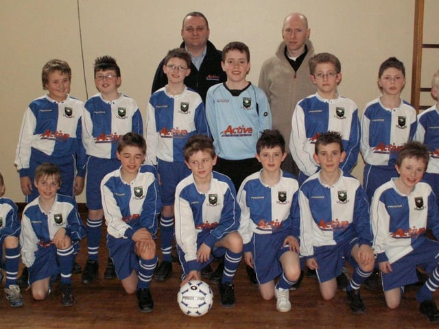 Pupils from Trench Road PS pictured wearing their new school football rig which has been sponsored by Noel McDermott (Active Clothing). Also included is Conrad McGuigan, team coach.