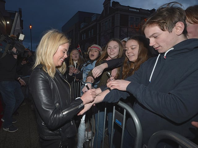 Derry Girls actor Saoirse Jackson autograph’s a fan’s arm outside the Omniplex Cinema, Strand Road, on Monday night last, as she arrived for the premiere of Series Two. DER0819GS-04