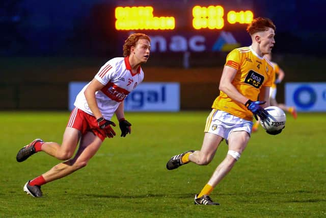 Derry’s Donnacha Gilmorecloses in on Antrim’s Sean O’Neill at Owenbeg during last week's Ulster Championship quarter-final. Photo: George Sweeney. DER2213GS – 060