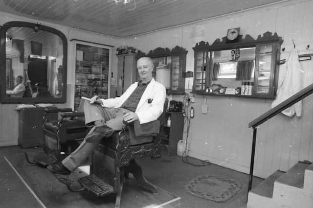 THE BARBER OF MOVILLE....Mr. Paddy Harkin after a hard day’s work in his barder shop in Moville.