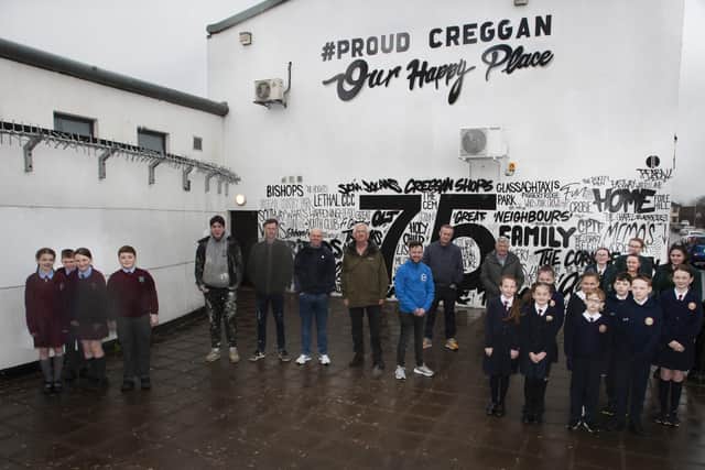 â€ ̃CREGGAN 75th MURAL LAUNCHâ€TM - Group pictured at the launch of the â€ ̃Proud Cregganâ€TM mural on Monday afternoon last. As part of the programme of activity, the Old Library Trust in partnership with the Gasyard Wall Feile and funded by Derry City and Strabane District Council delivered a â€ ̃Community Street Artâ€TM piece designed by the children and young people from St. Maryâ€TMs Youth Club, St. Ceciliaâ€TMs College, St. Joseph's Boysâ€TM School, Holy Child PS and St. John's PS that will celebrate what Creggan means to them. Included in the photo are pupils from St. Johnâ€TMs PS, Holy Child PS and St. Ceciliaâ€TMs College. Centre at back from left is Street art collective Peaball artists, George McGowan, project director, OLT, Martin Gallagher, Good Relations Department, DCSDC, Peter Nixon, St. Maryâ€TMs Youth Club, Gareth Stewart, Gasyard Wall Feile and Spasie McGilloway. (Photos: Jim McCafferty Photography)