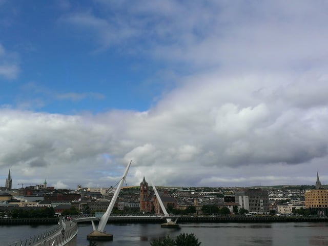 The city of Derry. Lisa McGee, the creator and writer of Derry Girls, has described the show as a love letter to her beautiful native city and says Derry is very much a character in its own right in the hit series. Undoubtedly the scenes shot in Derry from the ancient City Walls, to the Limewood Street/ Beechwood Street area, Creggan to the Bogside, the Waterside and beyond add greatly to the authenticity and the look and feel of the show. An ancient city situated on the border between the north and south of Ireland in the north west corner of Ireland, Derry and its hinterland in Counties Donegal, Derry, Tyrone and Antrim are becoming increasingly popular tourist destinations with ancient sites, great nightlife and stunning coastal scenery along the Wold Atlantic Way and the Causeway Coastal Route. The city, which has a population of around 110,000 people has a long and chequered history and its story is in many ways the history of Ireland over the centuries.