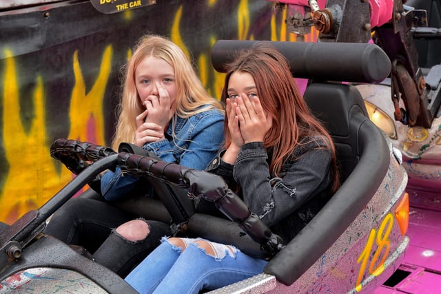 These shy girls enjoy the fun atmosphere at Cullen’s Amusements, in Ebrington, last weekend. DER2027GS - 013