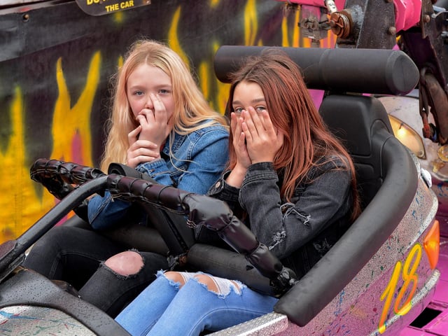 These shy girls enjoy the fun atmosphere at Cullen’s Amusements, in Ebrington, last weekend. DER2027GS - 013