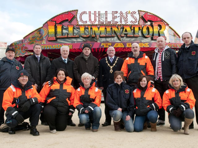 The Mayor, Kevin Campbell pictured at Cullen's Funfair which is being held in Ebrington Square from Friday 29th March until 7th April.   Cullen's Amusements will have collection boxes at the entrance of the funfair where donations can be made to Foyle Search and Rescue - the Mayor's chosen charity for this year. Included are Alderman Drew Thompson, Joe and Sean Cullen, Paul Doherty from ILEX, Sean Edwards and Ruari McAnaney from Foyle Search and Rescue with some of the volunteers. For more information on events being organised as part of the Mayor's Charity click on www.derrycity.gov.uk/mayor/mayorscharity. Picture Martin McKeown. Inpresspics.com. 29.3.1