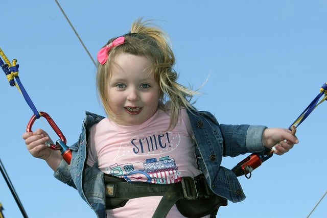 Bungee jumping for this young girl during Saturday's Cullens Funfair at Ebrington.  DER1315MC087
