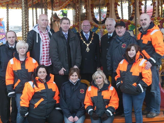 The Mayor, Kevin Campbell pictured at Cullen's Funfair which is being held in Ebrington Square from Friday 29th March until 7th April.   Cullen's Amusements will have collection boxes at the entrance of the funfair where donations can be made to Foyle Search and Rescue - the Mayor's chosen charity for this year. Included are Alderman Drew Thompson, Joe and Sean Cullen, Paul Doherty from ILEX, Sean Edwards and Ruari McAnaney from Foyle Search and Rescue with some of the volunteers. For more information on events being organised as part of the Mayor's Charity click on www.derrycity.gov.uk/mayor/mayorscharity. Picture Martin McKeown. Inpresspics.com. 29.3.1