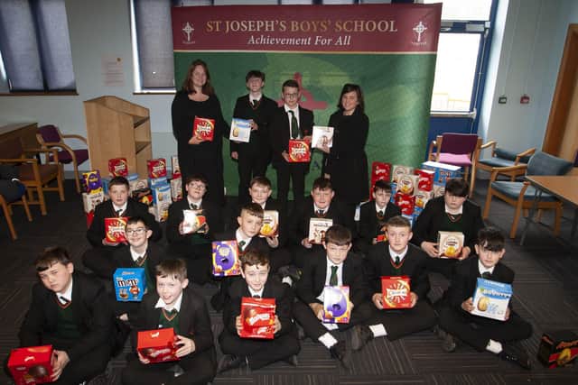 EASTER EGGS. . . . .Year 8 students from St. Josephâ€TMs Boys School pictured on Wednesday last with their Easter eggs, received for all their hard work in raising funds for Trocaire over the six week lenten period. Centre at back is teachers Mrs. Fiona Page and Mrs. Marie-Therese Newton handing over Easter eggs to Jayden Bradley and Reece Harkin. (Photos: Jim McCafferty Photography)