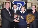 Mr. Aidan McKinney, Board of Governors, left, presenting the Northern Bank Cup for Mathematics to Michelle McGowan. Included are Martin Starrett (Single Science Award) and Tracey McCay (Double Science Award). (1/12/CD12)