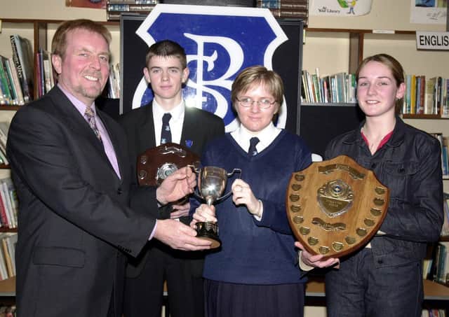 Mr. Aidan McKinney, Board of Governors, left, presenting the Northern Bank Cup for Mathematics to Michelle McGowan. Included are Martin Starrett (Single Science Award) and Tracey McCay (Double Science Award). (1/12/CD12)