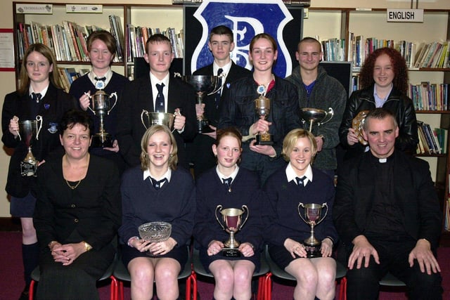 Councillor Lynn Fleming, Board of Governors, and Fr. Michael Canny, C.C., Waterside, pictured with subject prizewinners. Included at front are Deborah McFadden (English), Gemma Tracey (R.E.), and Aisling Morrison (History). Back, from left, are Lisa Kelly (Business Studies), Eileen McConomy (Drama), George Keddy (GNVQ ICT), Martin Starrett (GNVQ Manufacturing), Tracey McCay (Irish), Kevin McCann (Art and Design) and Michaela Clift (Geography). (1/12/CD13)