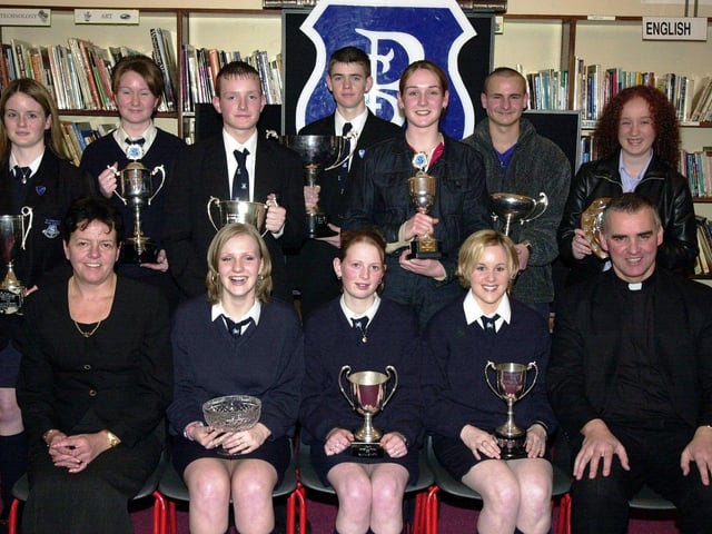 Councillor Lynn Fleming, Board of Governors, and Fr. Michael Canny, C.C., Waterside, pictured with subject prizewinners. Included at front are Deborah McFadden (English), Gemma Tracey (R.E.), and Aisling Morrison (History). Back, from left, are Lisa Kelly (Business Studies), Eileen McConomy (Drama), George Keddy (GNVQ ICT), Martin Starrett (GNVQ Manufacturing), Tracey McCay (Irish), Kevin McCann (Art and Design) and Michaela Clift (Geography). (1/12/CD13)