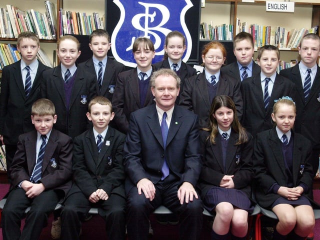 Martin McGuinness with Year 9 prizewinners. Front, from left, are Gavin Sweeney, Chris Harrison, Tara McGinley and Natalie McMonagle. Back, from left, are Aaron Sharkey, Laura Kyle, Kevin Gallagher, Louise Hutton, Deborah Callaghan, Caroline Harrigan, Stephen Crumley, Brian Smith and Kieran Harkin. (1/12/CD16)