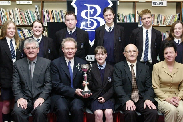 Mr. Martin McGuinness, Minister for Education, seated second, from left, presenting the Michelle Web Cup to Louise Hutton. Included at front, from left, are Mr. Paul Molloy, principal, Mr. John McLaughlin, Education Welfare Officer, and Councillor Lynn Fleming, Board of Governors. Back, from left, are Crest Science Award winners Roisin Chambers, Laura Duddy, Conor McLaughlin, Michaela McElhinney, Mark Rogan and Emma Gillen. (1/12/CD19)