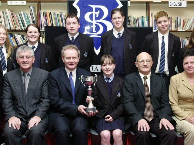 Mr. Martin McGuinness, Minister for Education, seated second, from left, presenting the Michelle Web Cup to Louise Hutton. Included at front, from left, are Mr. Paul Molloy, principal, Mr. John McLaughlin, Education Welfare Officer, and Councillor Lynn Fleming, Board of Governors. Back, from left, are Crest Science Award winners Roisin Chambers, Laura Duddy, Conor McLaughlin, Michaela McElhinney, Mark Rogan and Emma Gillen. (1/12/CD19)