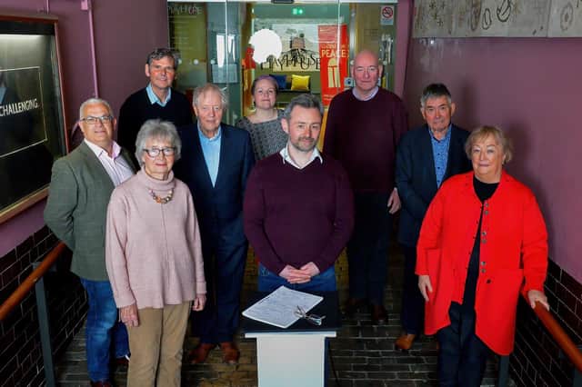 Pictured at the launch of a new musical drama ‘Beyond Belief: The Life and Mission of John Hume’ at the Playhouse on Monday afternoon last, with an original signed copy of the Good Friday Agreement, are, from left, Tim Attwood, Secretary of The John Hume Foundation, Kevin Murphy, CEO of the Playhouse, Brid Rodgers, leader of the SDLP team during the Good Friday Agreement talks, Professor Dean Farren, Chairperson of The John Hume Foundation, Sara Canning, Truth, Justice and Equality campaigner, Kieran Griffiths, Director and Producer at the Playhouse, Mark Durkan, former SDLP leader, Deputy First Minister and MP, Professor Paul Arthur, Professor of Politics, UU and Monica McWilliams Emeritus Professor UU and co-founder of the NI Women’s Coalition. Photo: George Sweeney. DER2215GS – 013