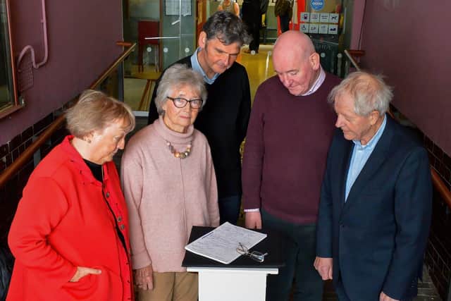 Kevin Murphy, CEO of the Playhouse, centre, pictured at the launch of a new musical drama ‘Beyond Belief: The Life and Mission of John Hume’ at the venue on Monday afternoon with an original signed copy of the Good Friday Agreement  and signatories of the document  Monica McWilliams Emeritus Professor UU and co-founder of the NI Women’s Coalition, Brid Rodgers, leader of the SDLP team during the Good Friday Agreement talks, Mark Durkan, former SDLP leader, Deputy First Minister and MP and Professor Sean Farren, Chairperson of The John Hume Foundation. Photo: George Sweeney. DER2215GS – 014