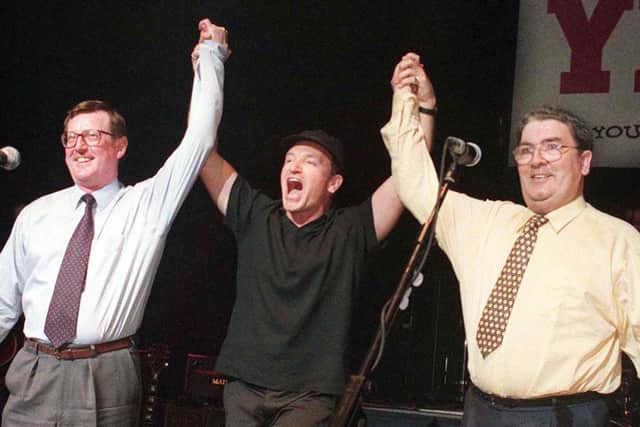 Unionist leader David Trimble, SDLP leader John Hume and Bono and U2 pictured together on stage at the Waterfront hall in Belfast this evening for a concert to promote a YES vote in the referendum