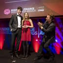 The Grandchildren of the late John Hume, Rachel (13) and Ollie (16) receiving applause from surprise guest Bono as they accept the TK Whitaker Award for Outstanding Contribution to Public Life on behalf of their late grandparents John and Pat Hume at the 47th annual Business & Finance Awards, in association with KPMG, took place at Dublin's Convention Centre.  Picture Andres Poveda