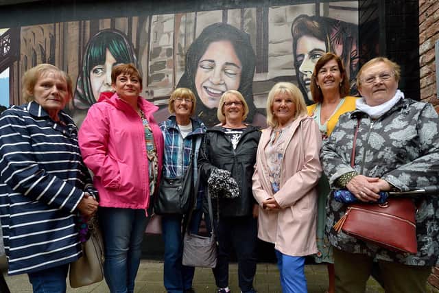 Some of the former Derry factory girls who attended the recent launch of the Factory Girls Murals in the Craft Village. DER3419GS- 034