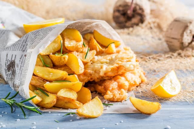 Closeup of delicious fish cod with chips with lemon