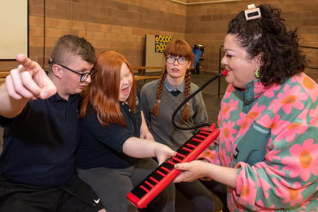 Shea, Tara and Aoibh from Ardnashee School pictured with jazz artist Meilana Gillard during an interactive workshop ahead of this years City of Derry Jazz and Big Band Festival which begins on the 28th of April continuing over the bank holiday weekend before concluding on the 2nd of May. Picture Martin McKeown. 06.04.22
