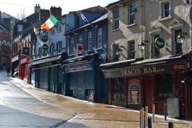 Bars on Waterloo Street closed and the street deserted on Wednesday afternoon last. DER1220GS - 012