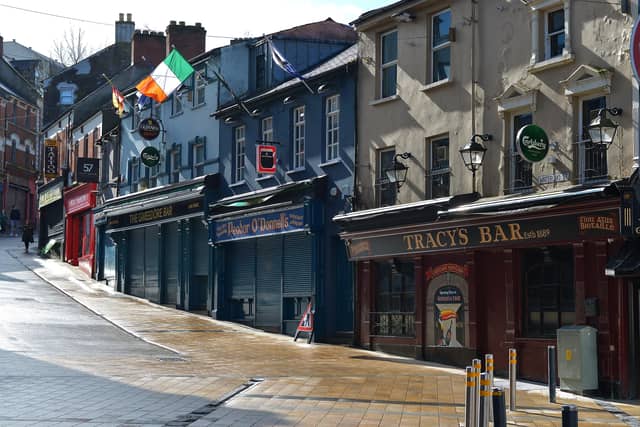 Bars on Waterloo Street closed and the street deserted on Wednesday afternoon last. DER1220GS - 012