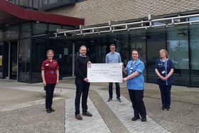 Conor Nichol, who raised £1,800 for the North West Cancer Centre by running 101 miles in one month. Conor made the presentation to NWCC staff Sinead Molloy, Dr McNicholl, Una O’Hara and Leanne Brandon.