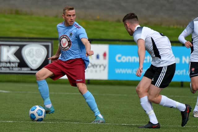 Institute striker Ian Parkhill surveys his options during Saturday's game against Queen's University. Picture by George Sweeney