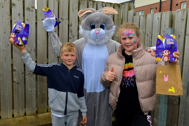 Corey and Clodagh pictured with the Easter Bunny at the Glenabbey Easter Party held in the Radius Housing Hub on Thursday afternoon last. DER2215GS – 032